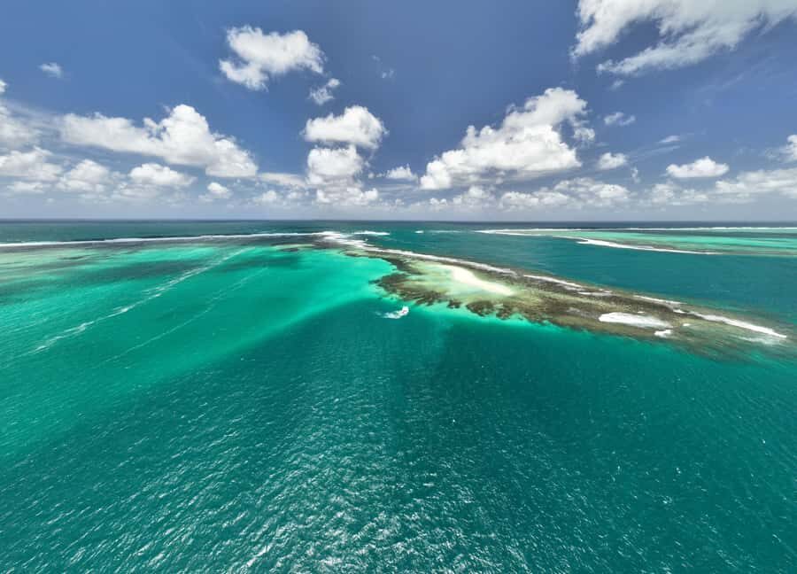 Catamaran Mauritius: South East 5 Islands Catamaran Cruises - Ile aux Cerfs: swimming, snorkeling, dolphins, and the full BBQ lunch setup