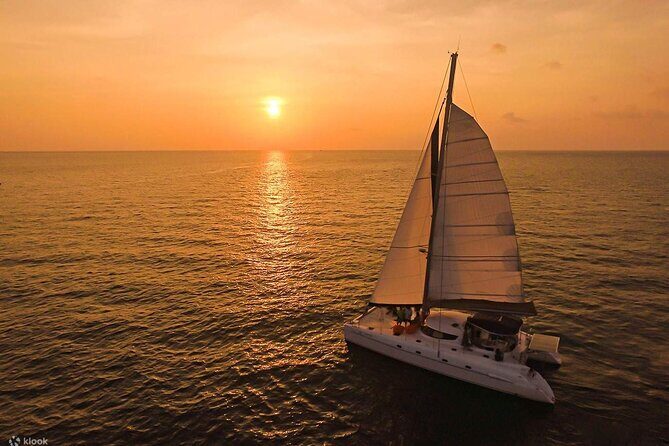 Private Exclusive Sundowner catamaran with Dinner & Transfer - Calm seas inside the lagoon: comfort vs. uncertainty
